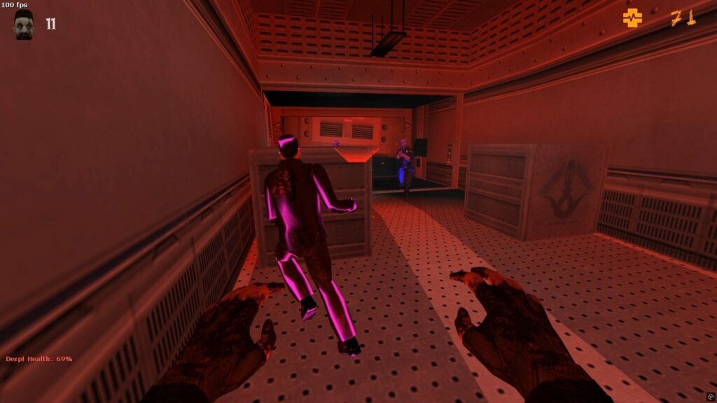 A player zombie hunts down two survivors in a corridor illuminated by emergency lighting.
