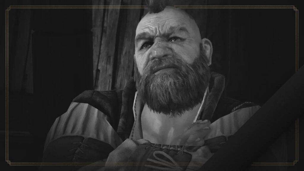 Black-and-white screenshot from The Witcher 3 of Zoltan Chivay with his arms crossed. The dwarf character has a big bushy beard and small spiky mohawk. The edge of the image is outlined by a thin gold frame.