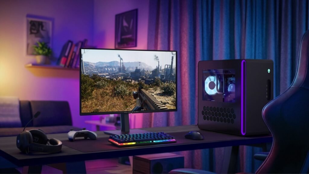 Alienware’s new $350 OLED gaming monitor could become the cheapest way to score the enviable panel tech Alienware AW2726DM gaming monitor in a room, next to an Alienware gaming PC