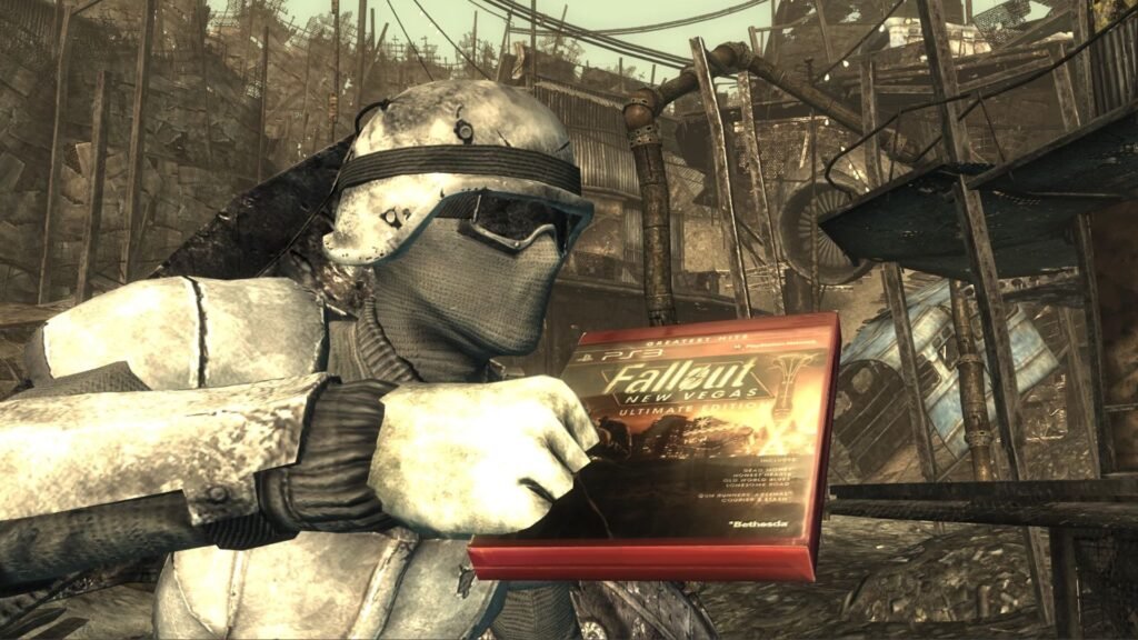 Fallout 3 character in winter combat armor holding a copy of Fallout: New Vegas for the PlayStation 3.