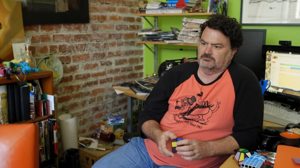 Double Fine, Ninja Theory, and more Xbox studios reportedly at risk of closure Tim Schafer sits at his desk, playing with a Rubik's cube in a Double Fine documentary video.