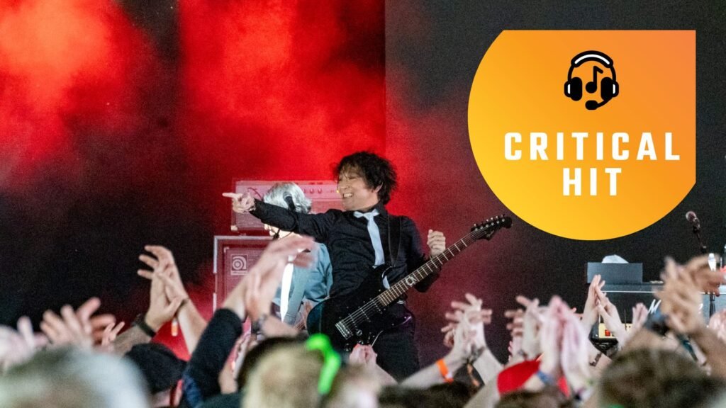 The Primals at Download Festival. Final Fantasy 14 composer Masayoshi Soken points towards the crowd as he smiles.